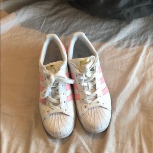 Pink stripped adidas superstars